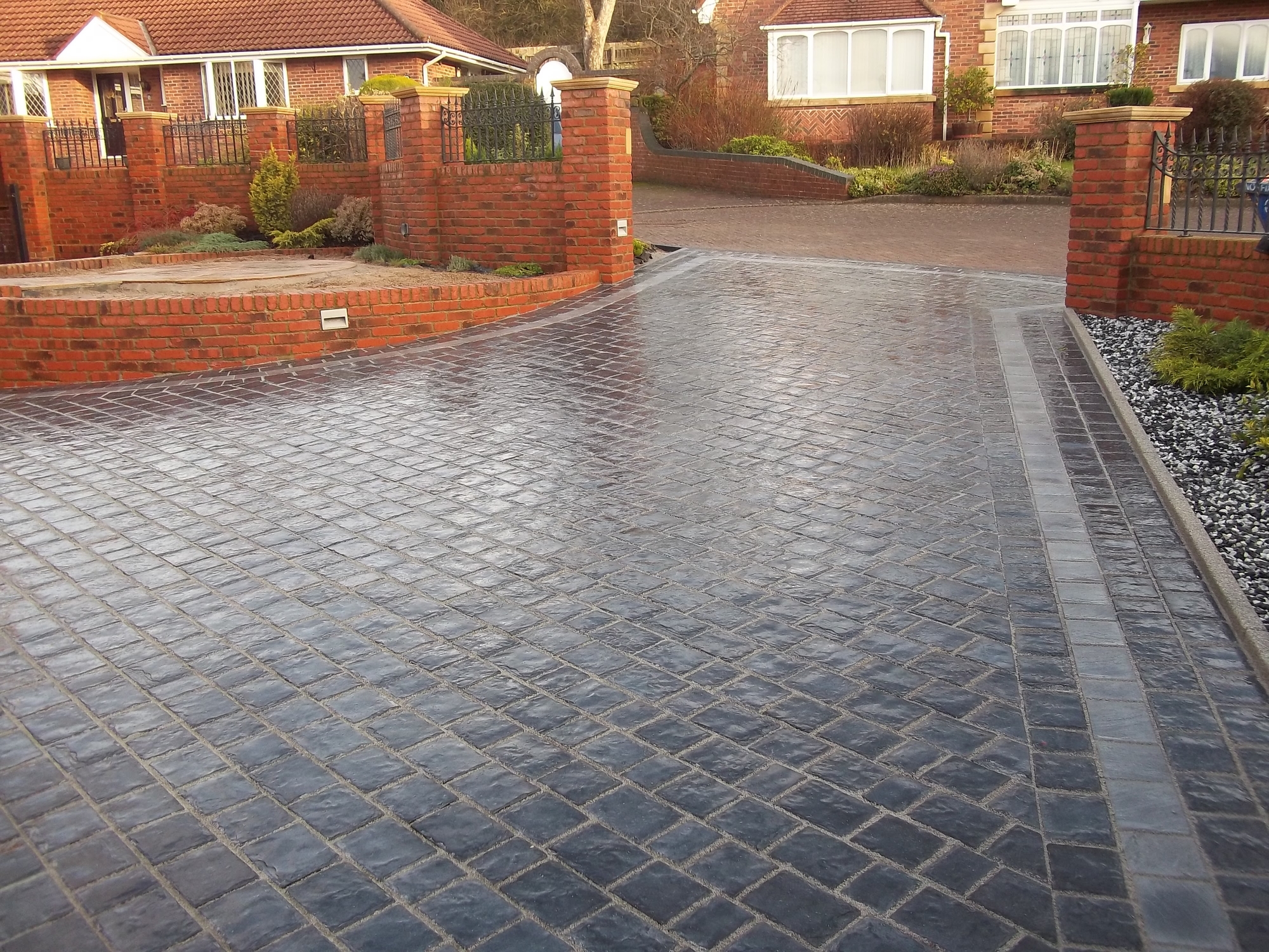 The after photo of a driveway being cleaned by Allen’s Complete Exterior Restoration